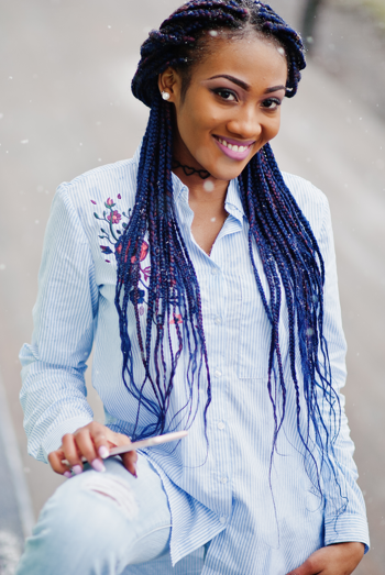 Beautiful smiling young woman with box braids
